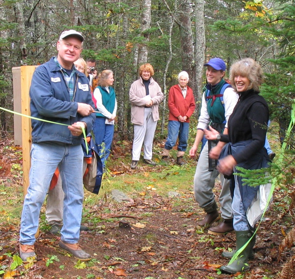 Peter Clapp cuts ribbon to open trail